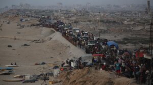 Palestinians flee with their belongings loaded on vehicles and carts as others walk along Rashid Street towards the south of Gaza, following intensified Israeli airstrikes and evacuation orders in the northern areas of the enclave in Gaza City, Gaza on Sept. 17, 2025.