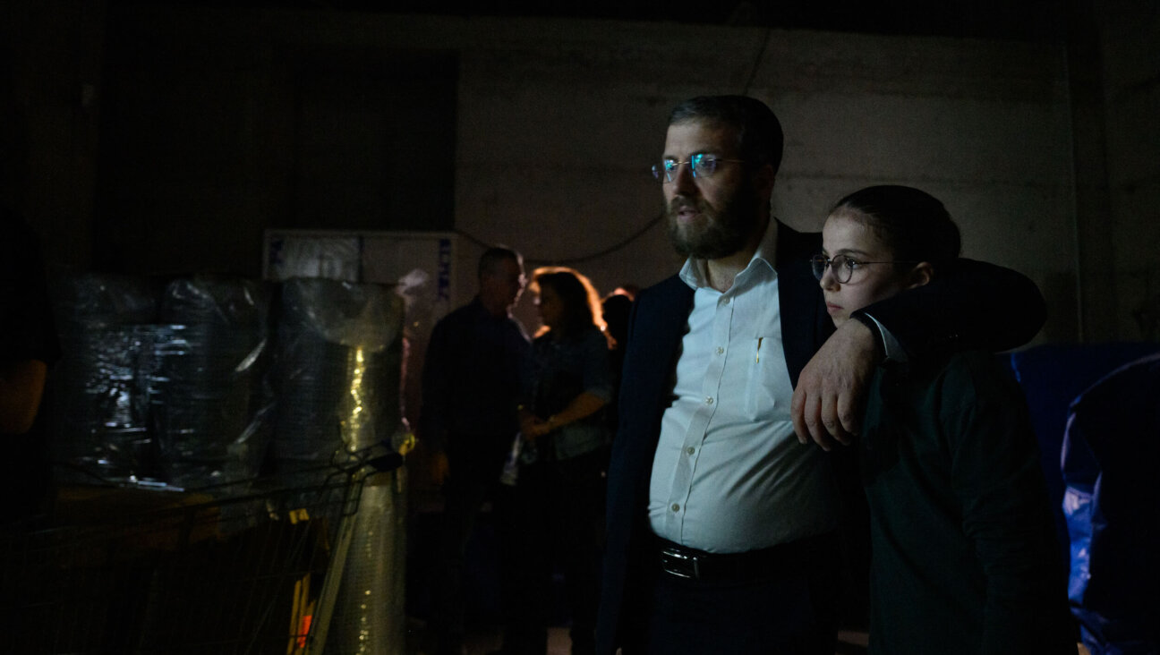 People huddle in a bomb shelter in Holon, Israel amid an incoming Iranian missile warning on March 17.