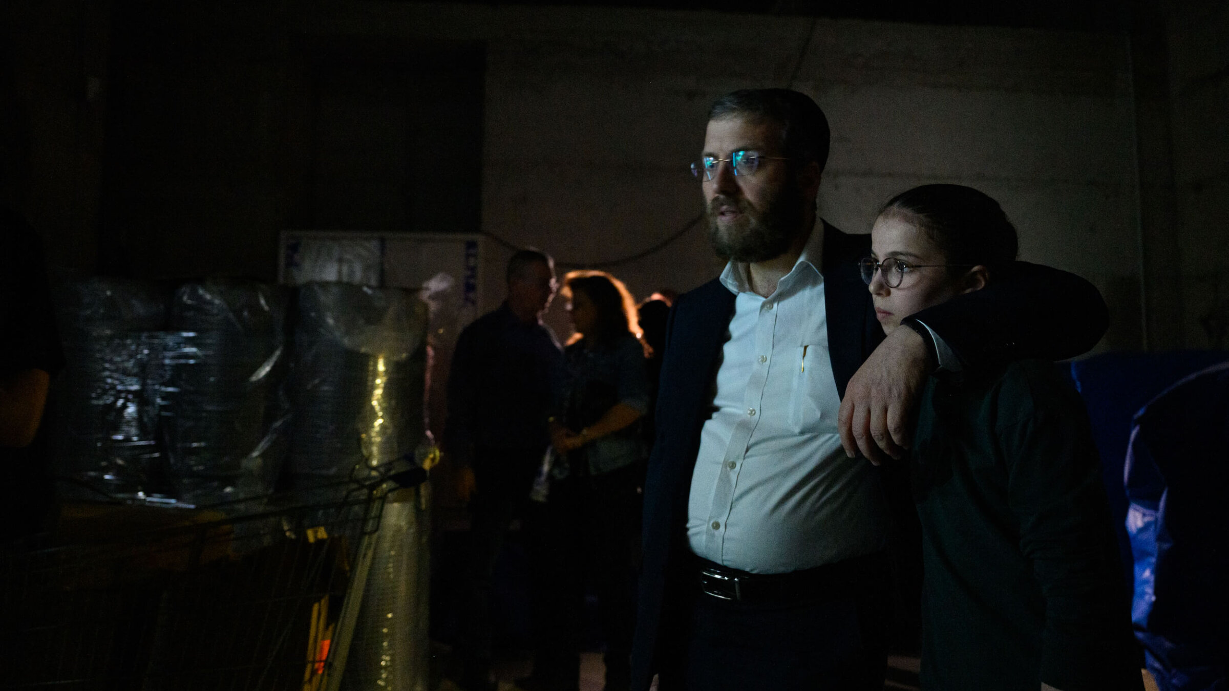 People huddle in a bomb shelter in Holon, Israel amid an incoming Iranian missile warning on March 17.