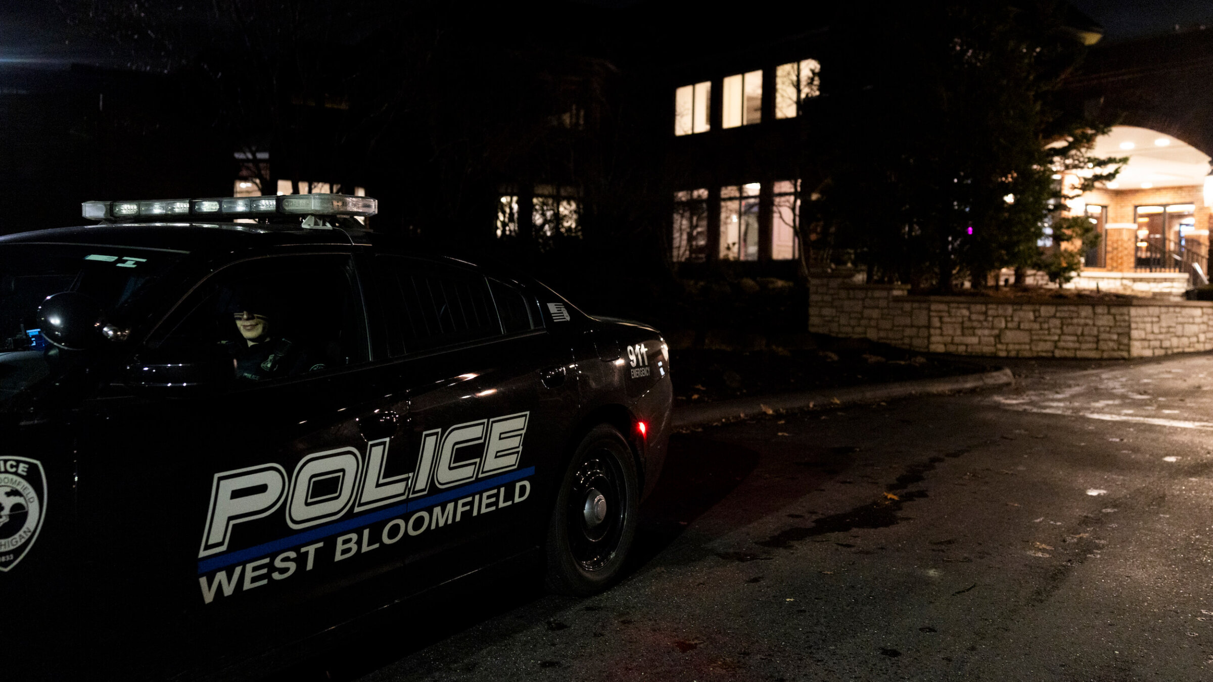 A police officer patrols outside of a Bat Mitzvah at Tam O'Shanter Country Club on March 13 in West Bloomfield, Michigan. The ceremony was moved from Temple Israel after a gunman rammed a vehicle into the synagogue and opened fire on Thursday.