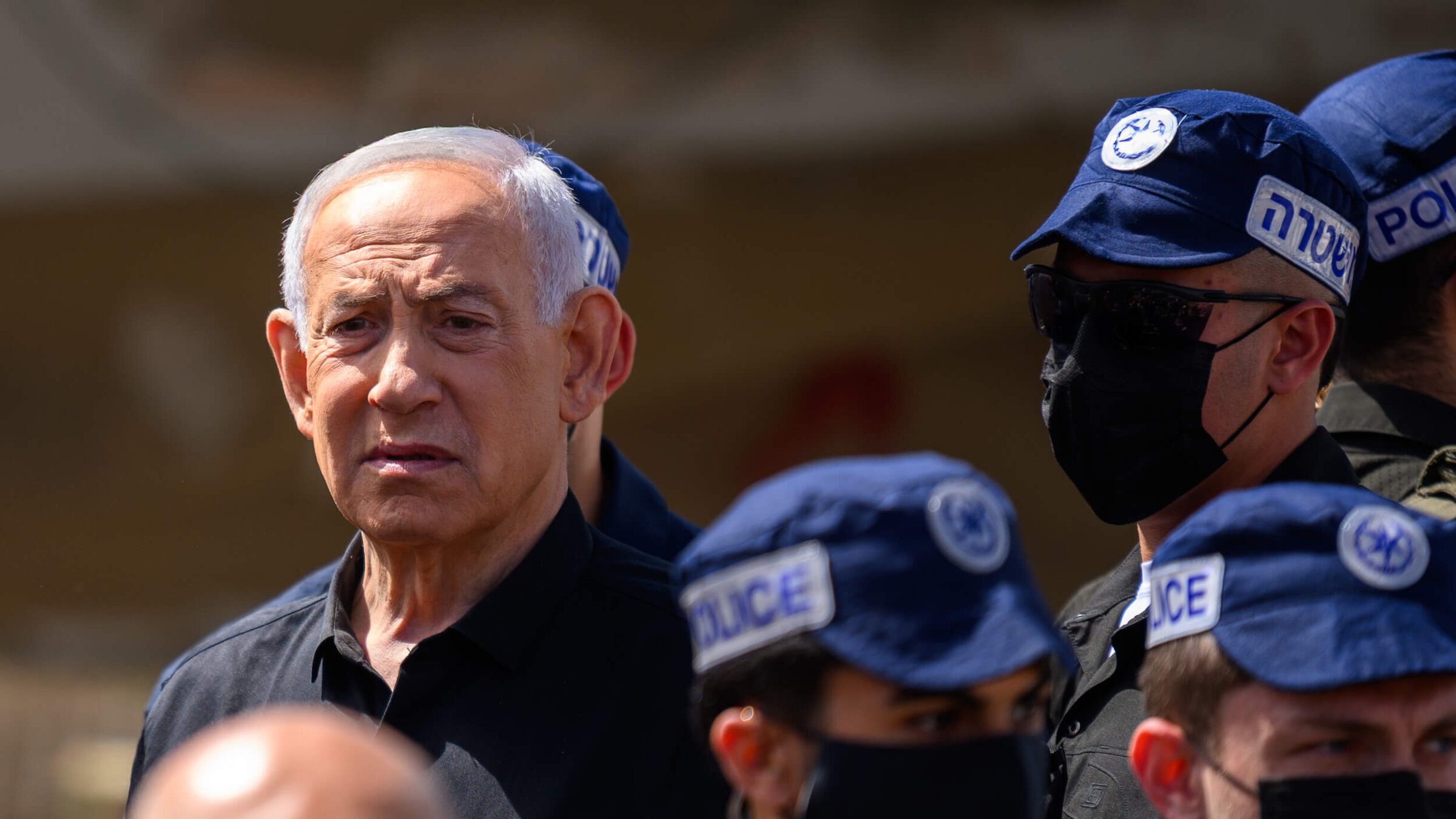 Israeli Prime Minister Benjamin Netanyahu visits an area destroyed by an Iranian ballistic missile in Dimona, Israel — leaving more than 50 wounded — on March 22.