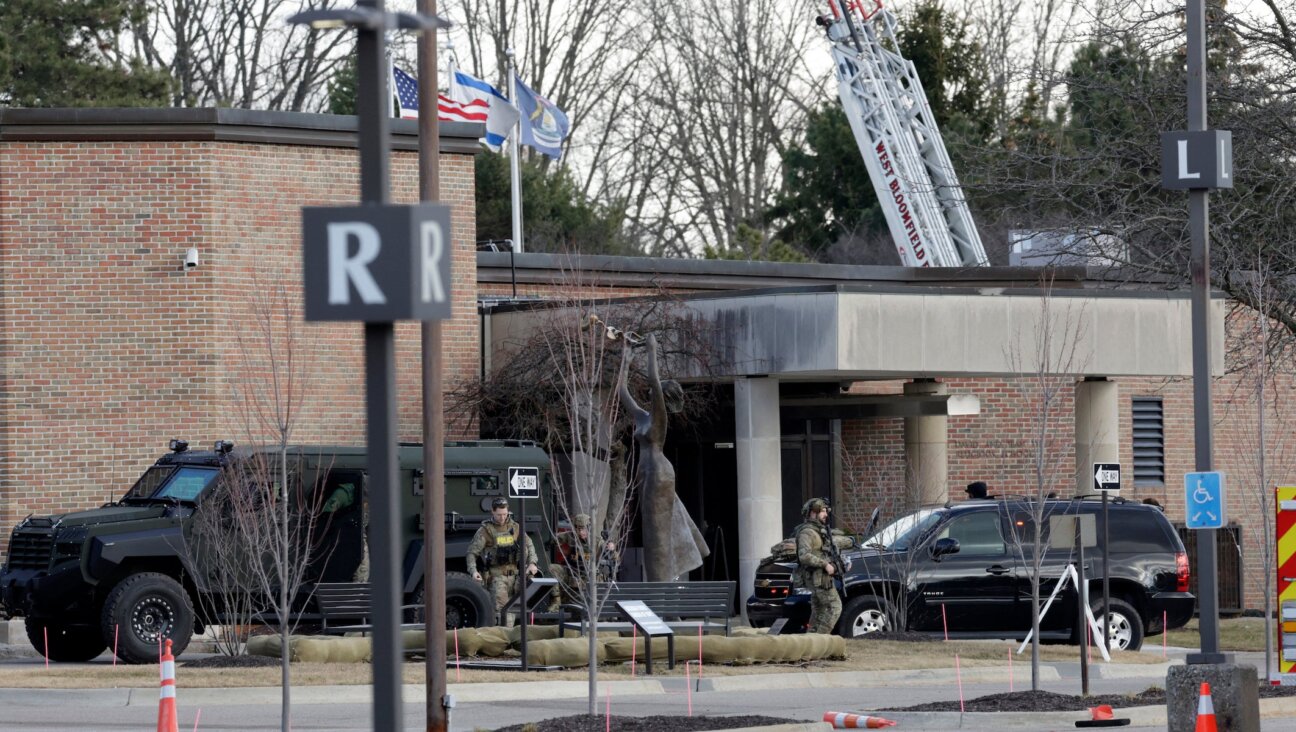 Law enforcement remain on site at the Temple Israel synagogue in West Bloomfield, Michigan, a Detroit suburb, on March 12, 2026, after an assailant drove a vehicle into the building. (JEFF KOWALSKY / AFP)