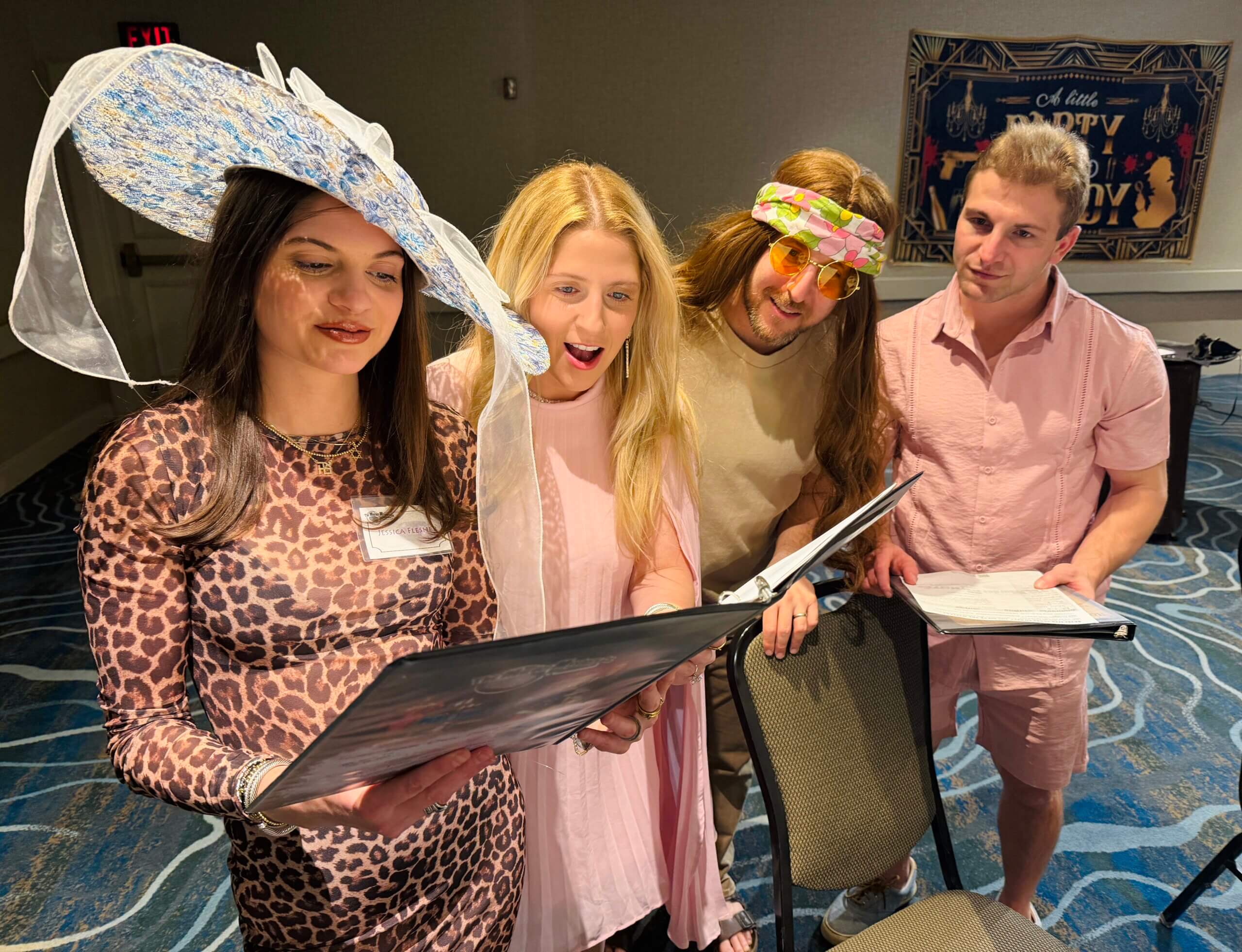 Left to right: Rosalie Silberg, Isabella Silberg, Ben Aussenberg, and Shane Ross at a Purim-themed murder mystery dinner in Tulsa, Oklahoma.