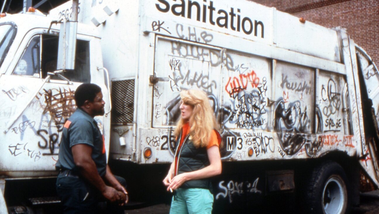 Mierle Laderman Ukeles speaks with a sanitation worker in an archival photo. (Courtesy Toby Perl Freilich)