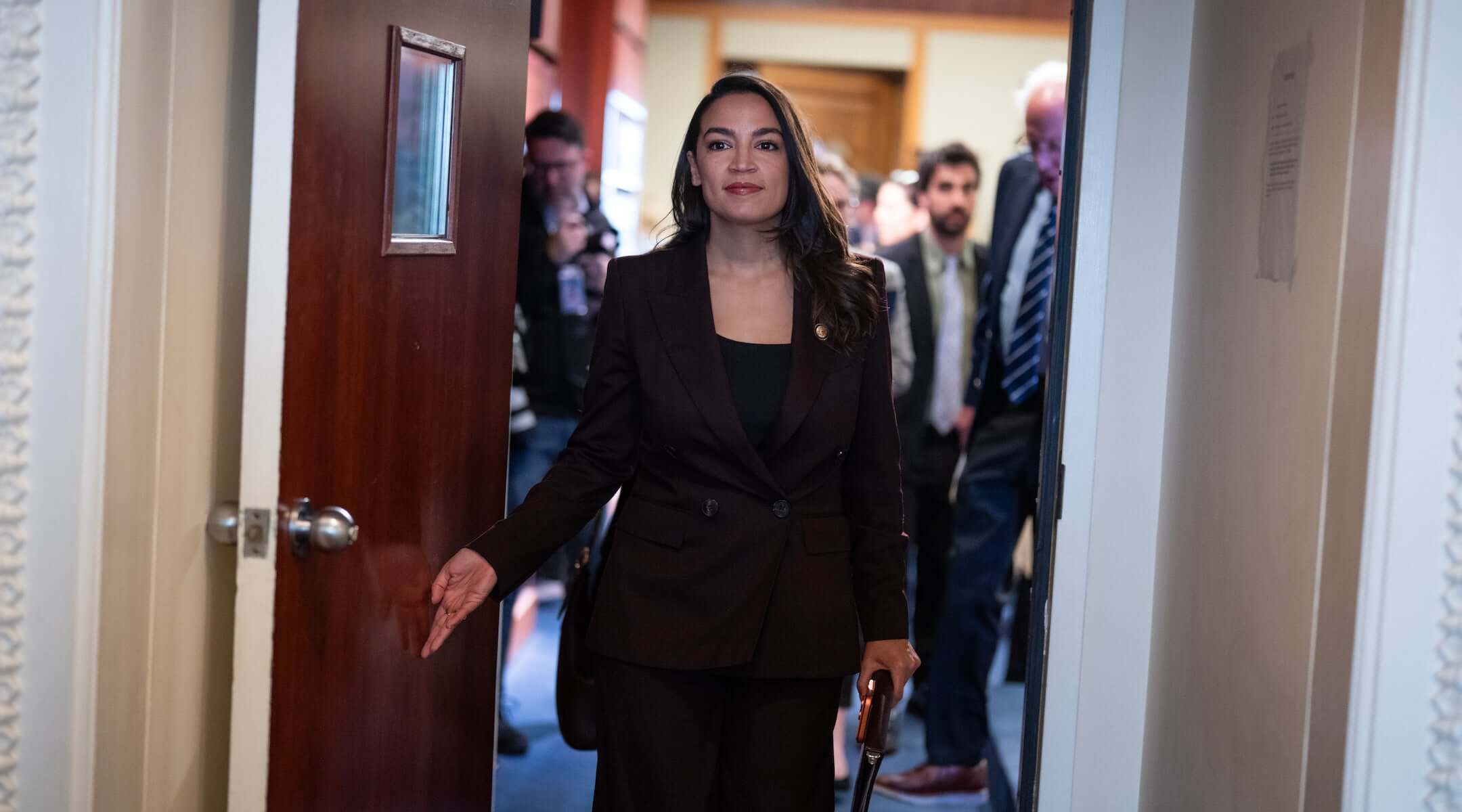 Rep. Alexandria Ocasio-Cortez, D-N.Y., and Sen. Bernie Sanders, I-Vt., conclude a news conference announcing the Artificial Intelligence Data Center Moratorium Act in the U.S. Capitol on Wednesday, March 25, 2026. The legislation aims to “ensure that AI benefits workers, is safe and effective and does not harm communities or destroy the environment.” (Tom Williams/CQ Roll Call)