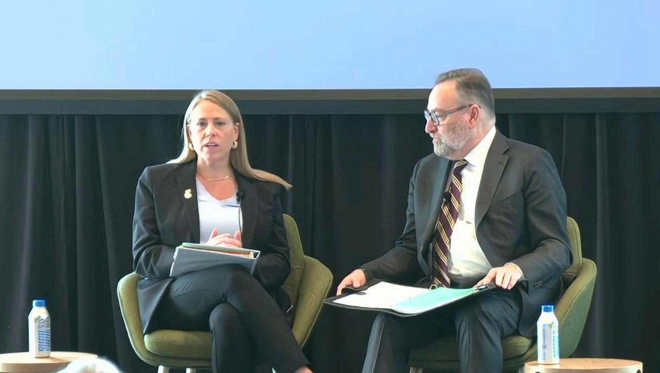 (L-r) Andrea Lucas, chair of the federal Equal Employment Opportunity Commission, speaks with Brandeis Center founder Kenneth Marcus at an antisemitism conference held at Harvard University in Cambridge, Massachusetts, April 16, 2026. (Screenshot)