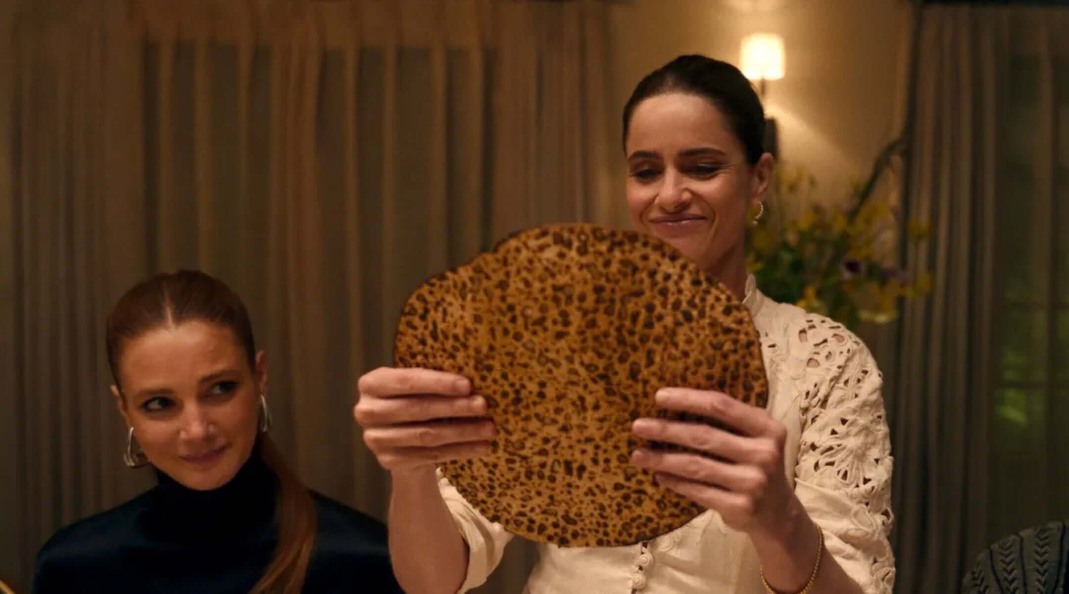 Actress Amanda Peet breaking the middle matzo on 'Your Friends & Neughbors.'