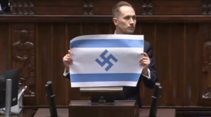 “Israel is the new Third Reich, and its flag should look exactly like this,” Konrad Berkowicz said as he unfurled the flag in parliament. (Screenshot via X)