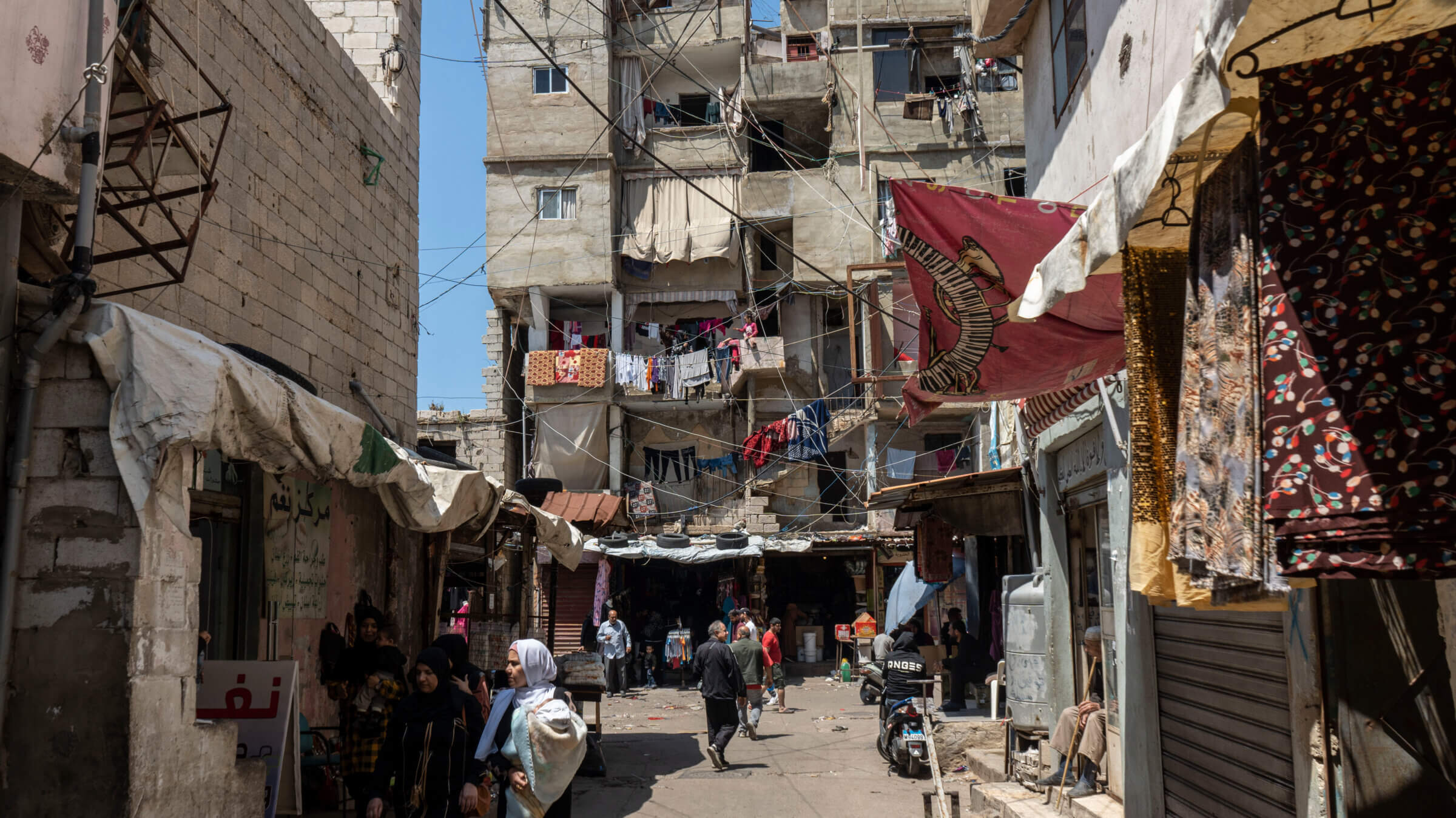 Laundry hangs to dry on washing lines across a street in the Shatila Palestinian refugee camp in Beirut, Lebanon, on Monday, May 1, 2023. 