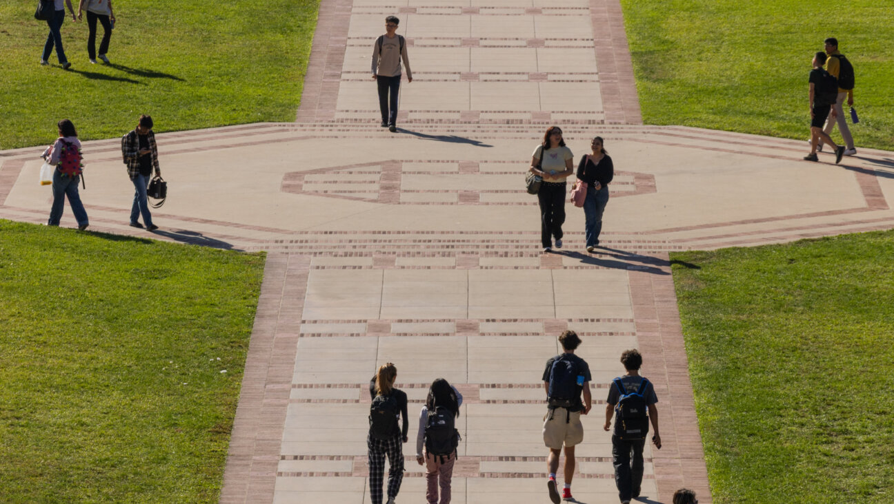 Students walk across Wilson Plaza at the the University of California, Los Angeles campus on Tuesday, Oct. 7, 2025.
