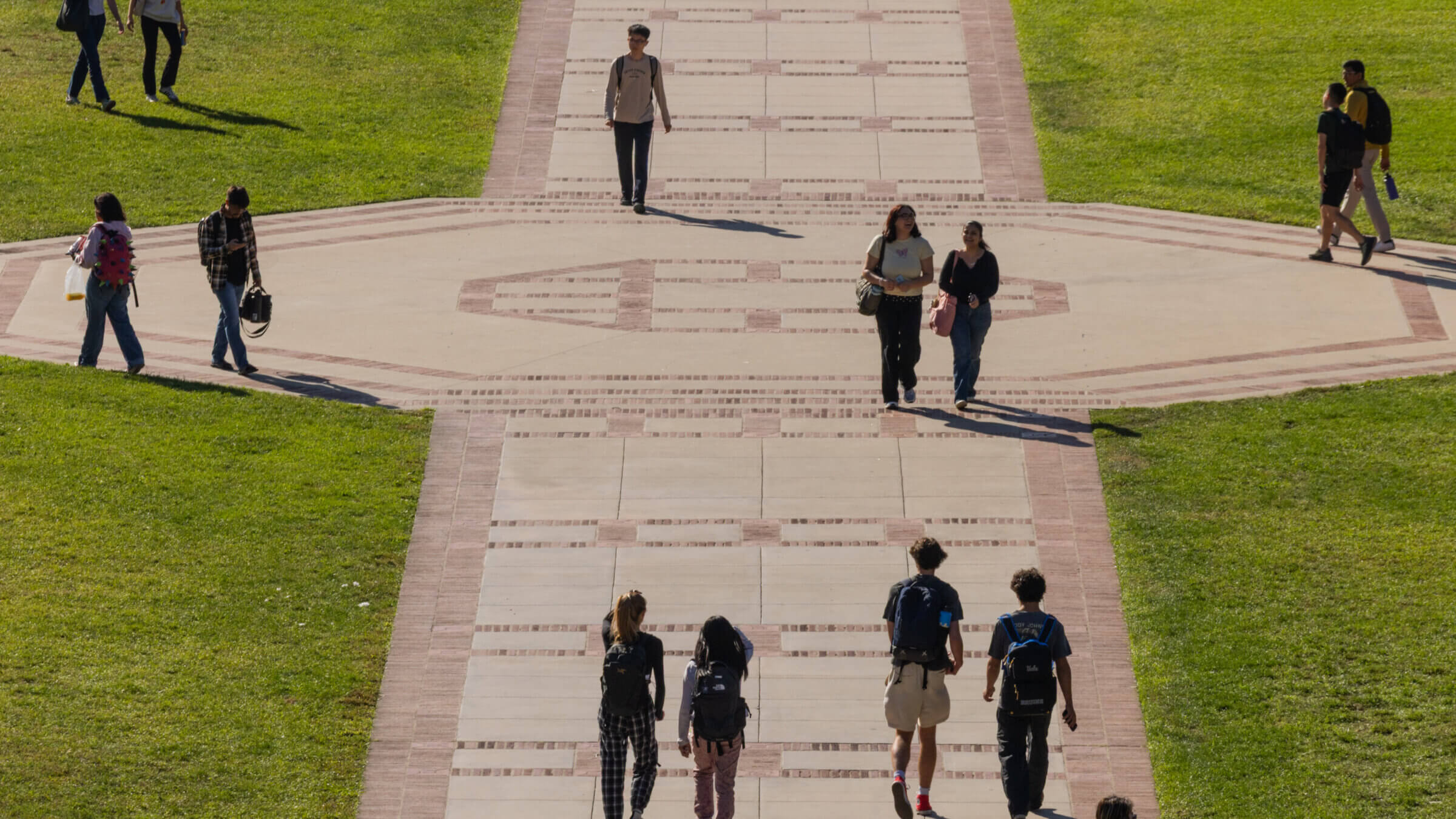 Students walk across Wilson Plaza at the the University of California, Los Angeles campus on Tuesday, Oct. 7, 2025.