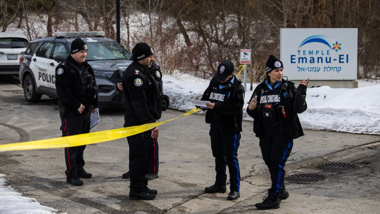 Police investigate the site of North York's Temple Emanu-El after it was shot at late on a Monday night, Toronto, Mar. 3, 2026.