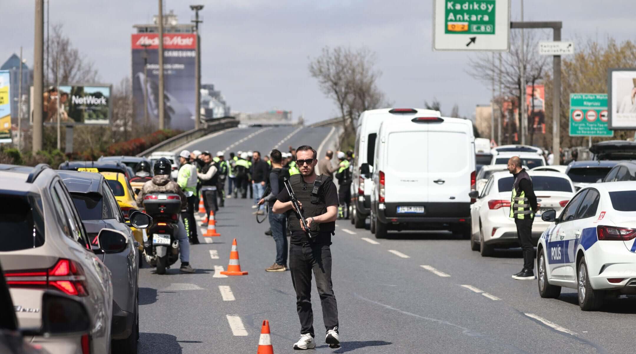 Police stand by a cordoned-off area outside a building that houses the Israeli Consulate after gunman opened fire on April 7, 2026 in Istanbul, Turkey.