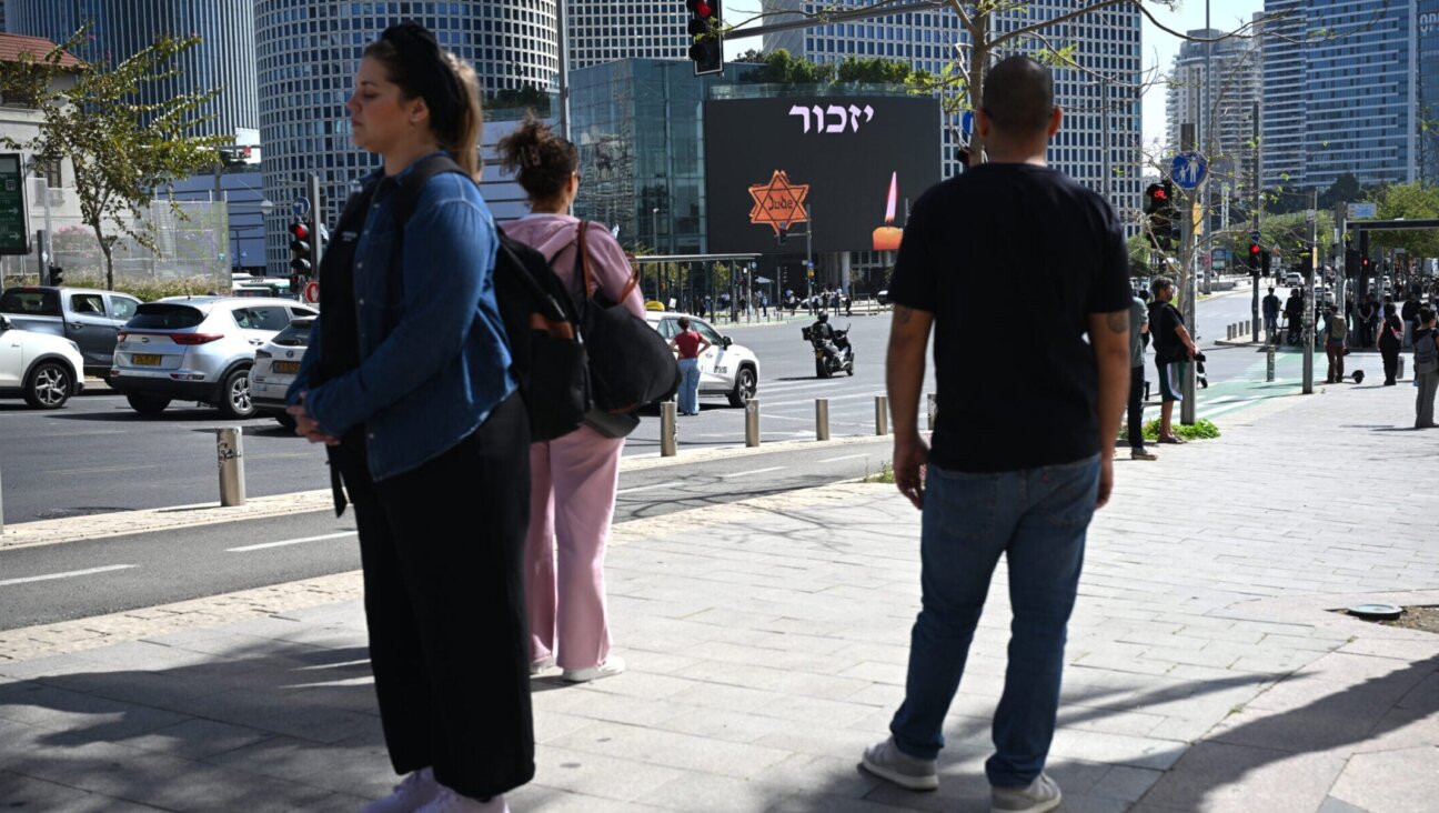 Israelis observe a two-minute to mark Yom HaShoah at Azrieli junction on April 14, 2026 in Tel Aviv.