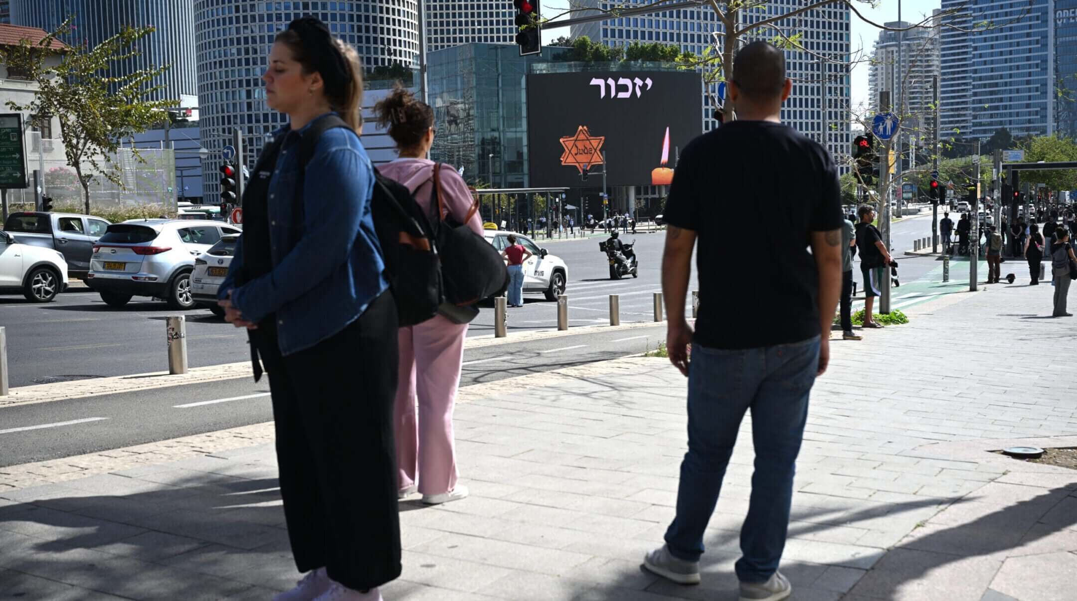Israelis observe a two-minute to mark Yom HaShoah at Azrieli junction on April 14, 2026 in Tel Aviv.
