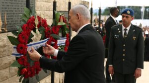 Israeli Prime Minister Benjamin Netanyahu places a wreath during a ceremony marking Israel’s Memorial Day for fallen soldiers at the military cemetery on Mount Herzl in Jerusalem, April 21, 2026. (Ilia Yefimovich / Pool / AFP via Getty Images)