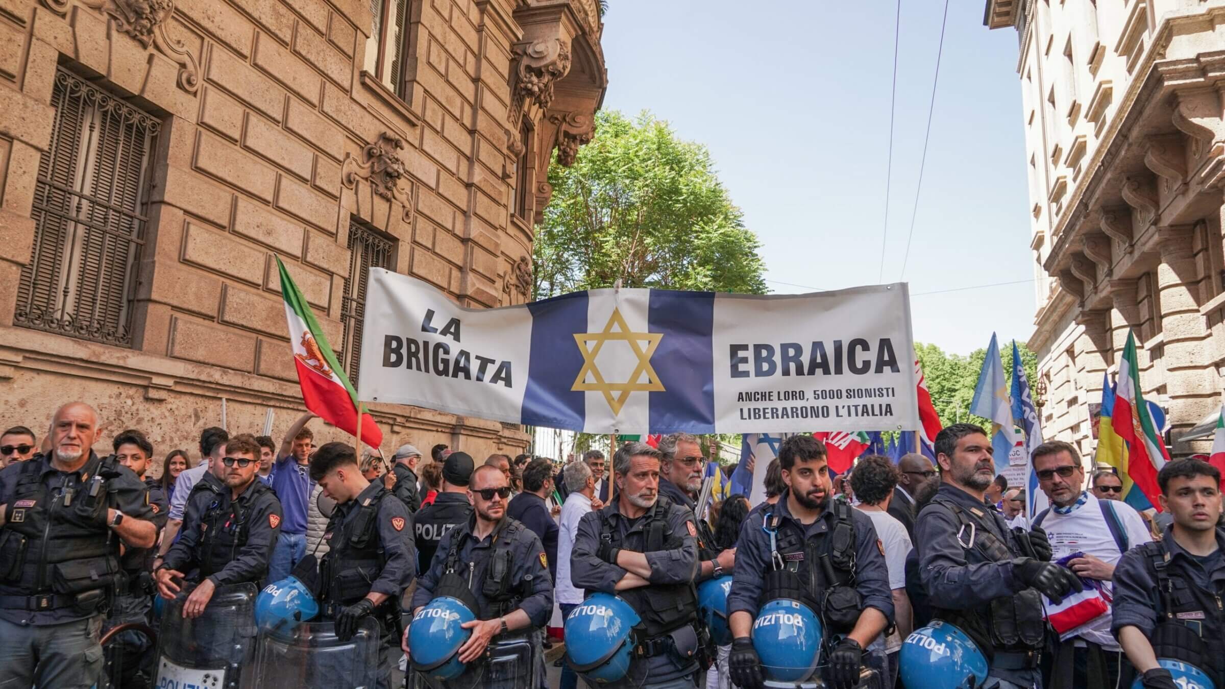 Police surround attendees with a “Jewish Brigade” banner during a march marking Italy’s liberation from Nazism in Milan, Italy, April 25, 2026. (Emanuele Roberto De Carli/NurPhoto via Getty Images)