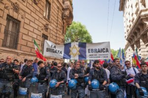 Police surround attendees with a “Jewish Brigade” banner during a march marking Italy’s liberation from Nazism in Milan, Italy, April 25, 2026. (Emanuele Roberto De Carli/NurPhoto via Getty Images)