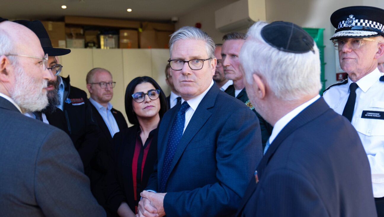 Home Secretary Shabana Mahmood, Prime Minister Sir Keir Starmer and Metropolitan Police Commissioner Sir Mark Rowley speak with members of the Jewish community during a visit to Golders Green on April 30, 2026 in London.(Stefan Rousseau – WPA Pool/Getty Images)
