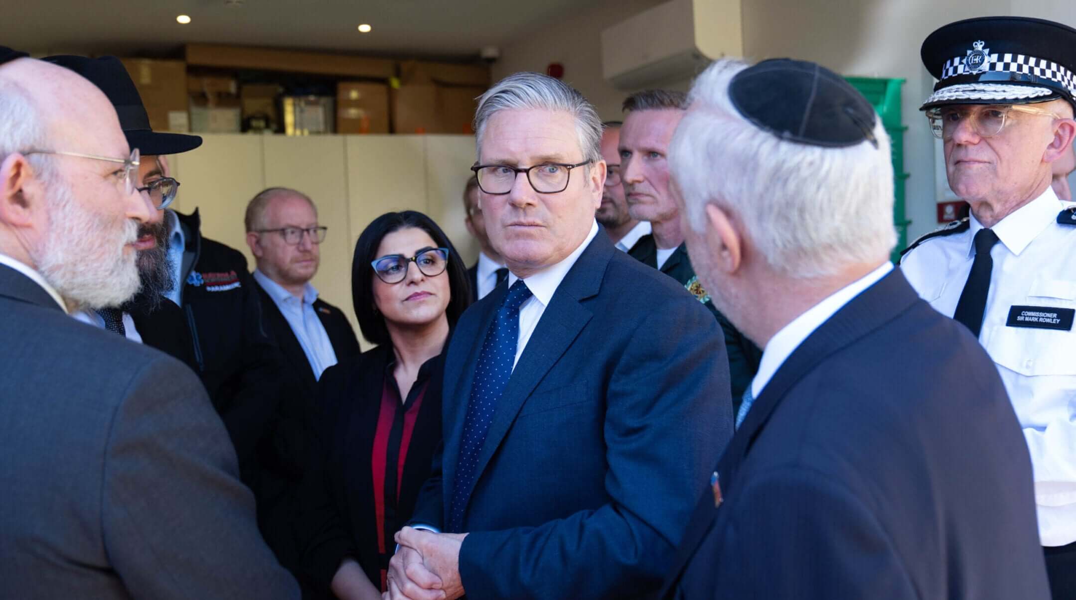Home Secretary Shabana Mahmood, Prime Minister Sir Keir Starmer and Metropolitan Police Commissioner Sir Mark Rowley speak with members of the Jewish community during a visit to Golders Green on April 30, 2026 in London.(Stefan Rousseau – WPA Pool/Getty Images)