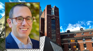 Rabbi Mikę Uram has been tapped to become the ninth chancellor of the Jewish Theological Seminary, seen at rear.