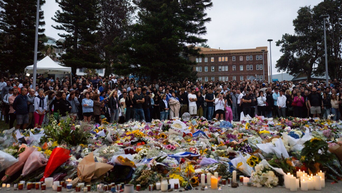 Community members gather outside of Bondi Pavilion at Bondi Beach, Sydney, following the deadly shooting on a Hanukkah party, Dec. 15, 2025.