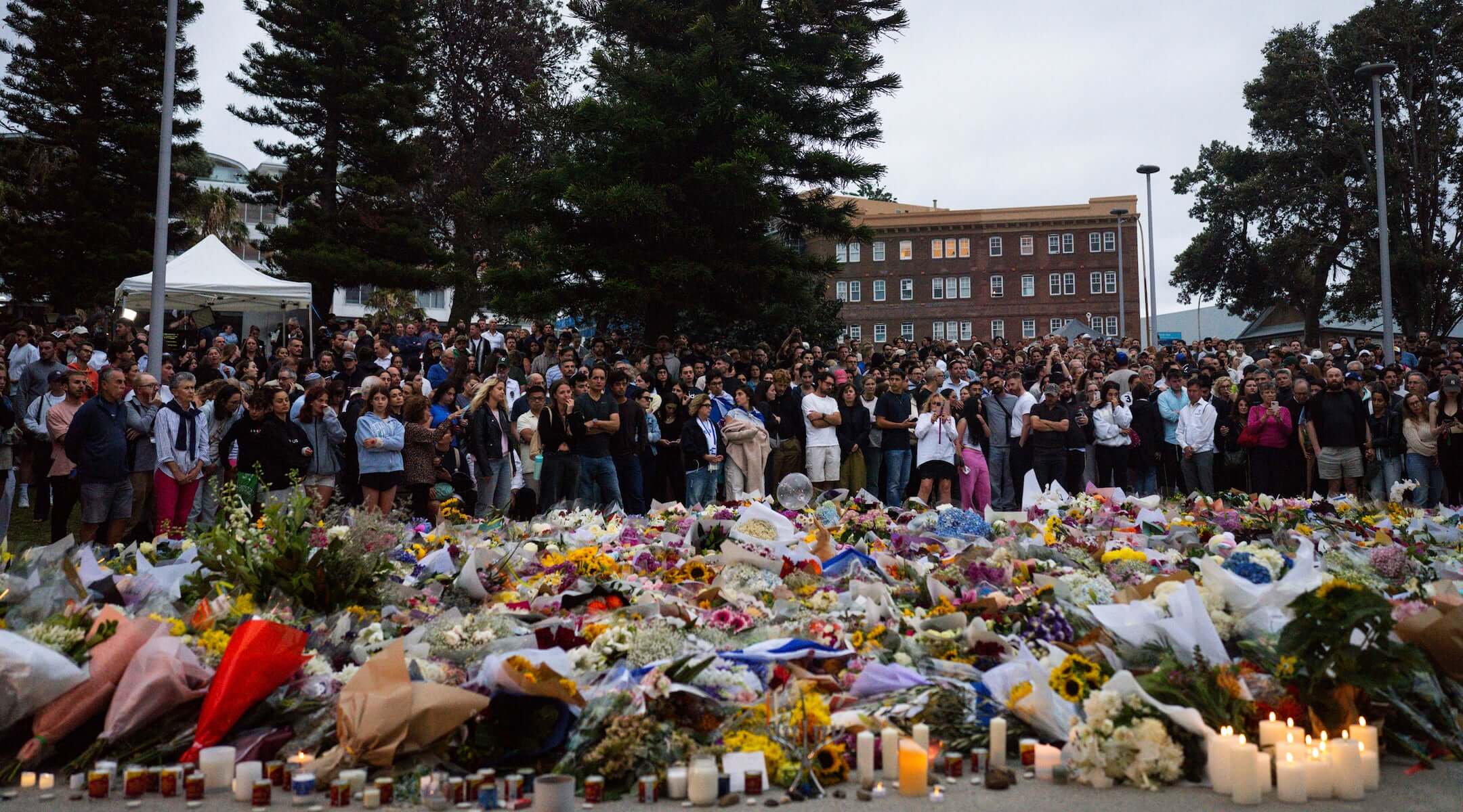 Community members gather outside of Bondi Pavilion at Bondi Beach, Sydney, following the deadly shooting on a Hanukkah party, Dec. 15, 2025.