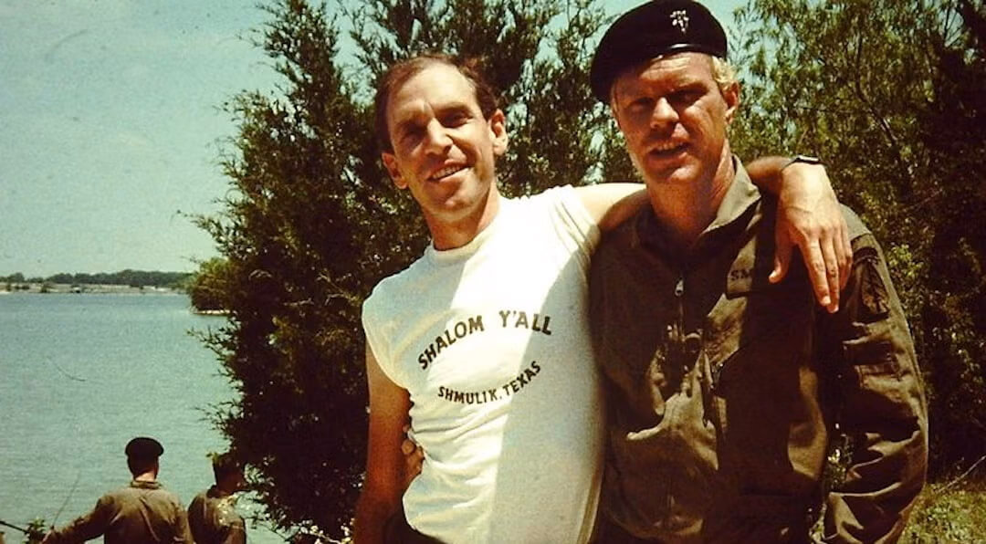Sam Firstenberg, left, and an actor on the set of "Riverbend." The director's t-shirt includes a reference to his given name, Shmulik.