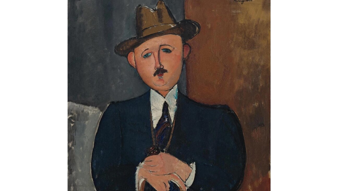 A judge ruled in 2026 that Amedeo Modigliani’s “Seated Man with a Cane,” shown here in part, must be returned to the family of the man who owned it before the Holocaust. (Courtesy Sotheby’s)