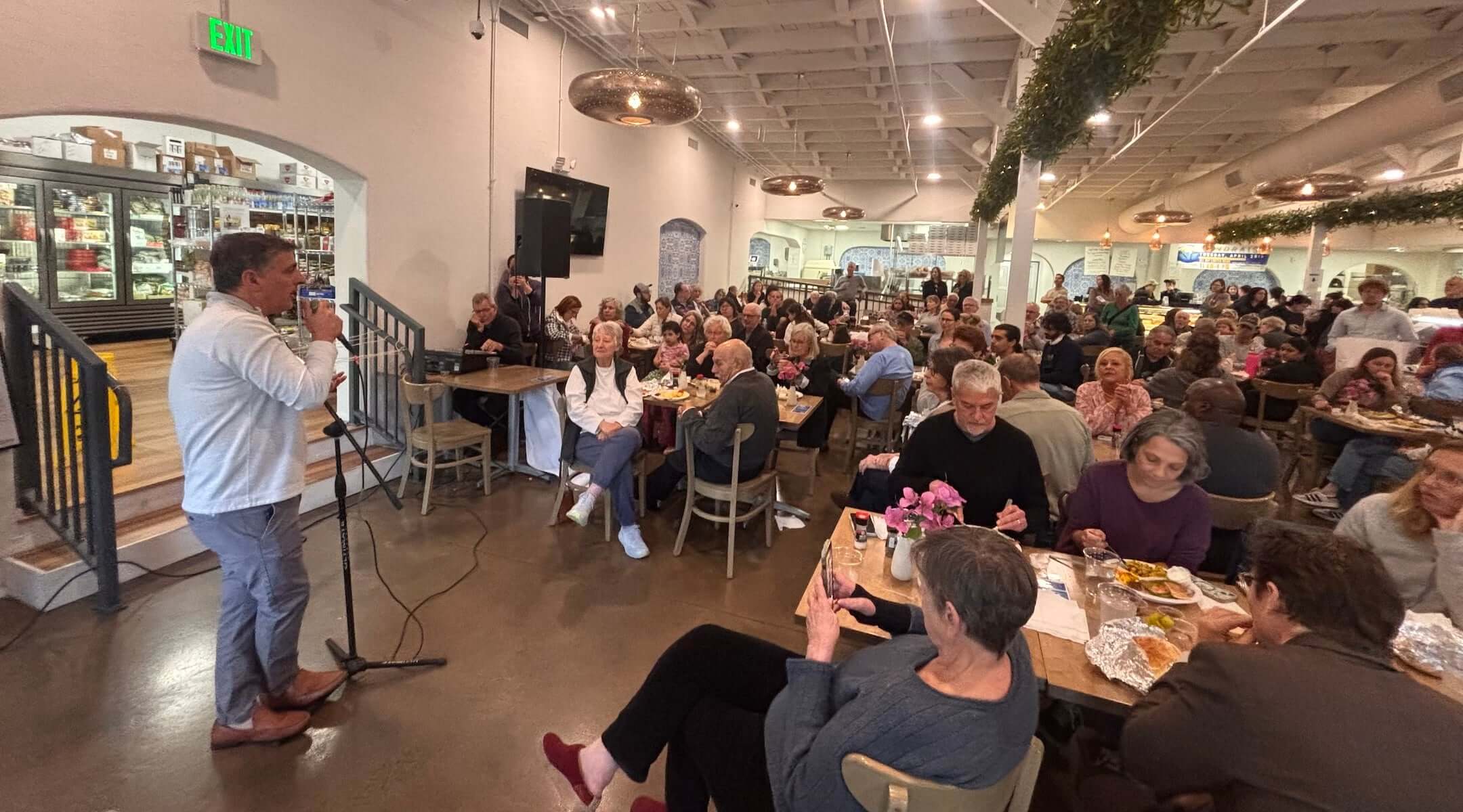 Dr. David Hasan, the founder of The Gaza Children Village, speaks at Mediterranean Deli in Chapel Hill, North Carolina, on April 28, 2026. (Courtesy of Rabbi Daniel Greyber)