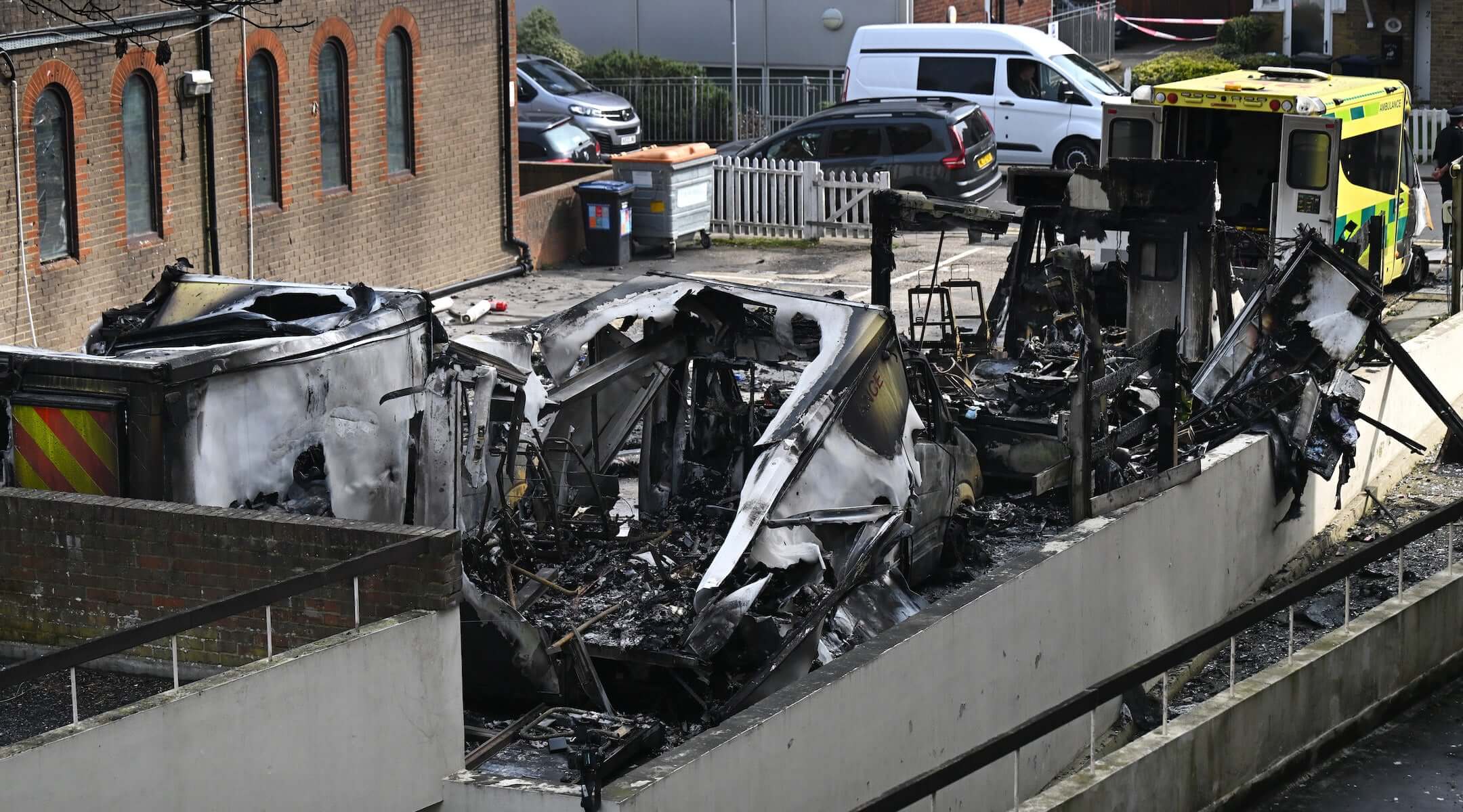 The burnt wreckage of Hatzola ambulances as fire services continue to monitor the scene after they were set on fire overnight next to Machzike Hadath Synagogue, on March 23, 2026 in the Golders Green area of London, England.