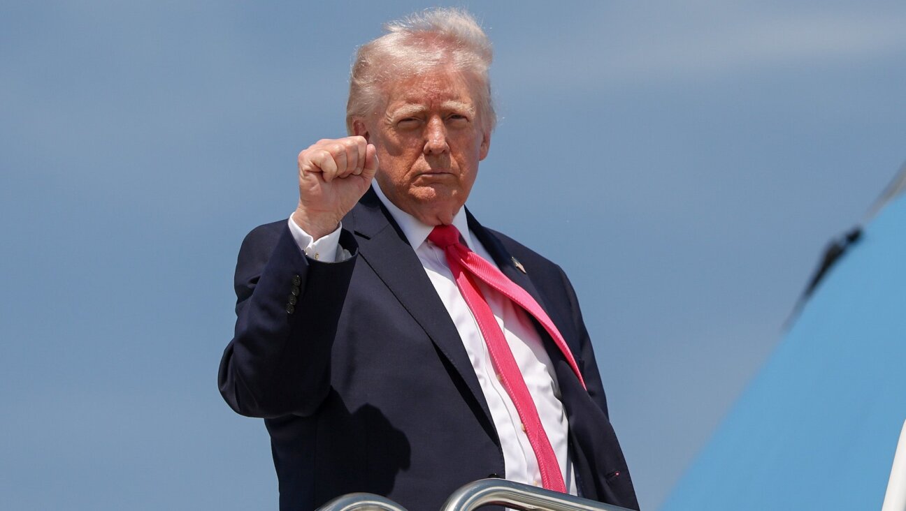 President Donald Trump gestures as he boards Air Force One on April 16, 2026 at Joint Base Andrews, Maryland.