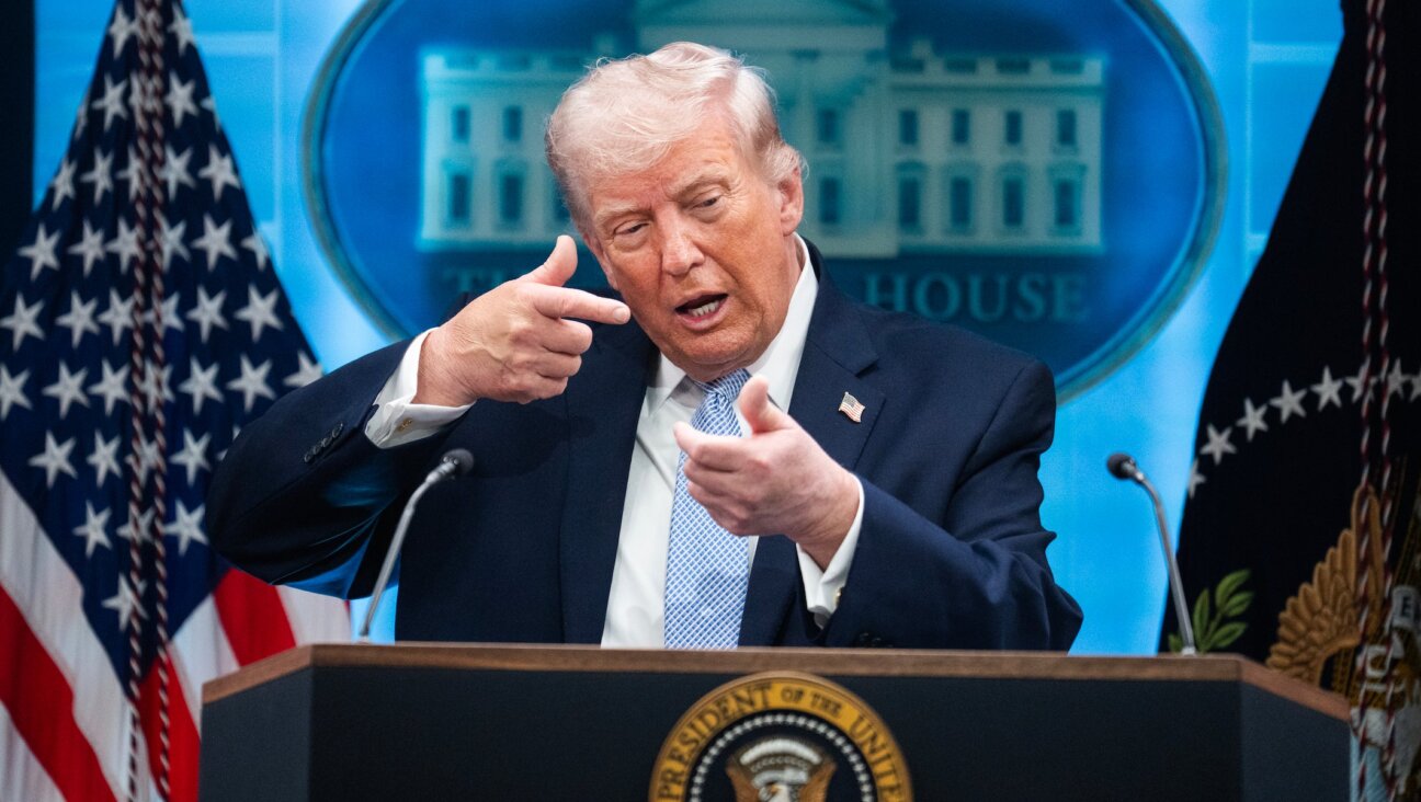 President Donald Trump mimics firing a gun during a news conference in the White House briefing room about the war in Iran on Monday, April 6, 2026. (Tom Williams/CQ Roll Call)