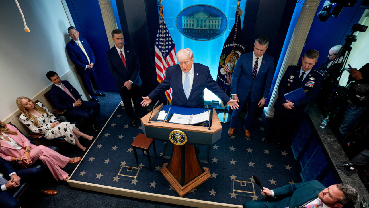 President Donald Trump, accompanied by CIA Director John Ratcliffe, Secretary of War Pete Hegseth and Chairman of the Joint Chiefs of Staff General Dan Caine.