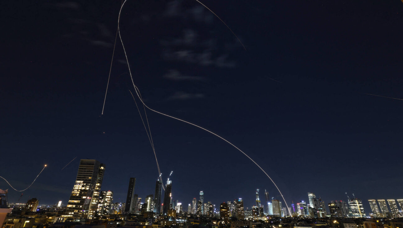 Rocket trails from an interception by Israel's Iron Dome missile defence system are pictured over Tel Aviv on March 1.
