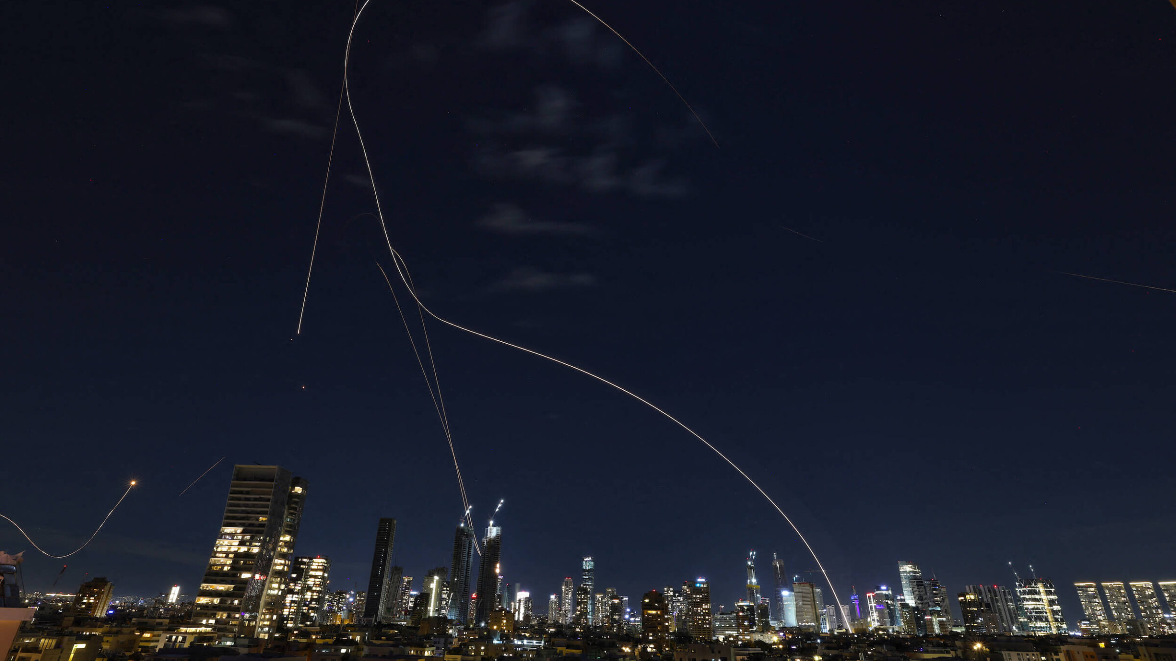 Rocket trails from an interception by Israel's Iron Dome missile defence system are pictured over Tel Aviv on March 1.