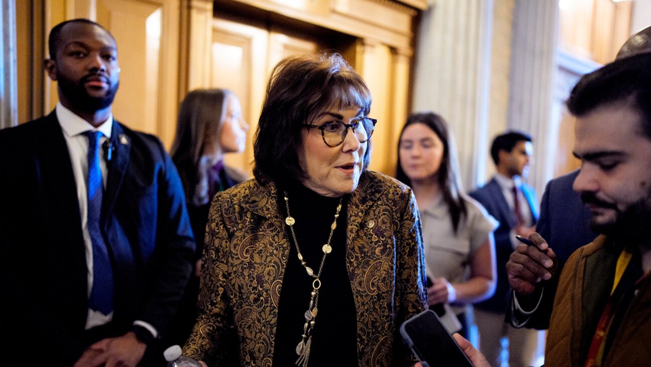 Sen. Jacky Rosen walks into the Senate Chamber on December 11, 2025 in Washington, D.C.