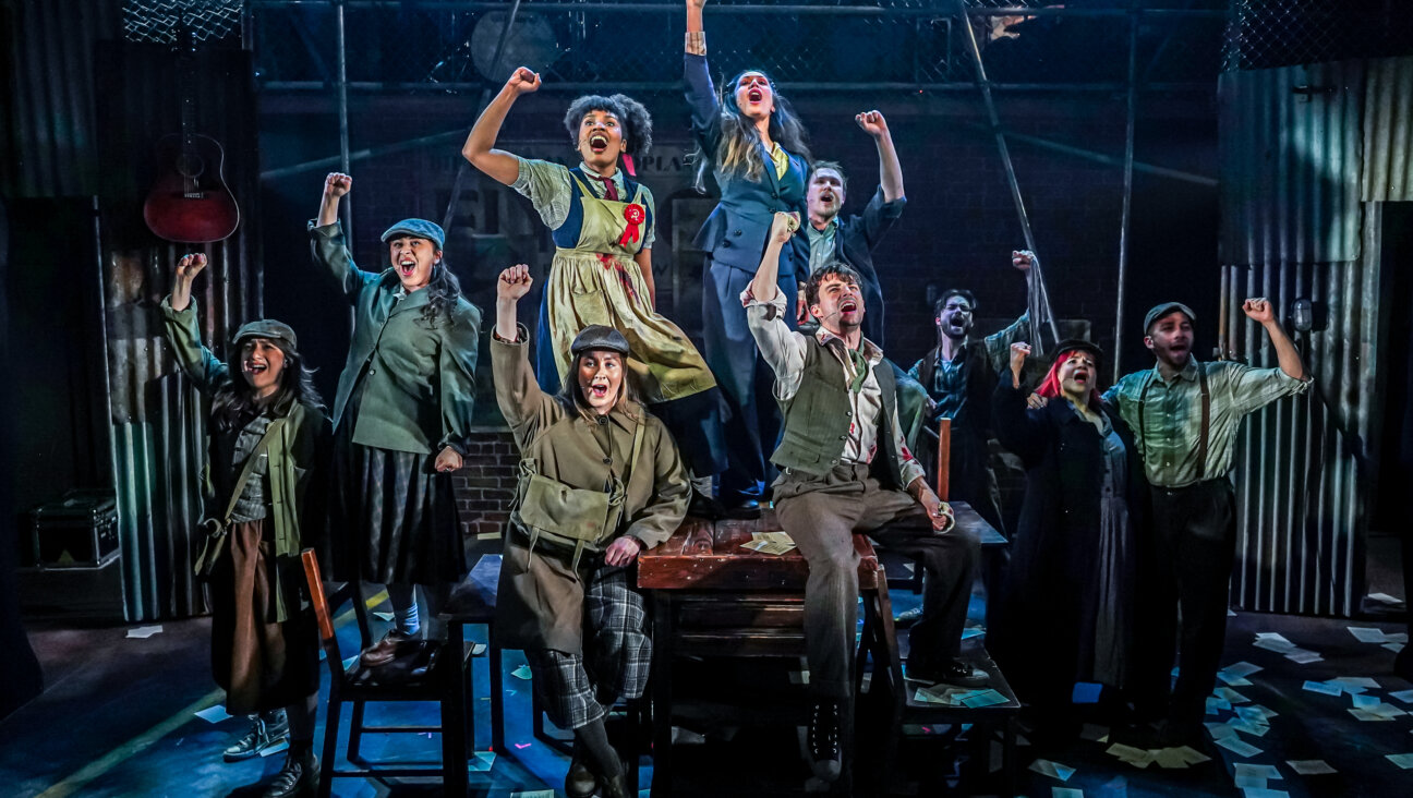 The cast of <i>Cable Street</i> pump their fists following a short-lived victory over fascism.
