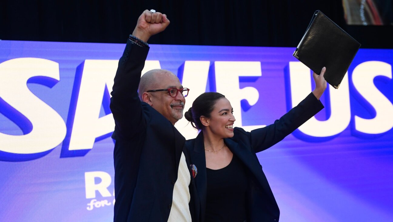 State Rep. Chris Rabb, left, and Rep. Alexandria Ocasio-Cortez, right, share the stage during a Rabb for Congress rally on May 15, 2026, Philadelphia, Pennsylvania.