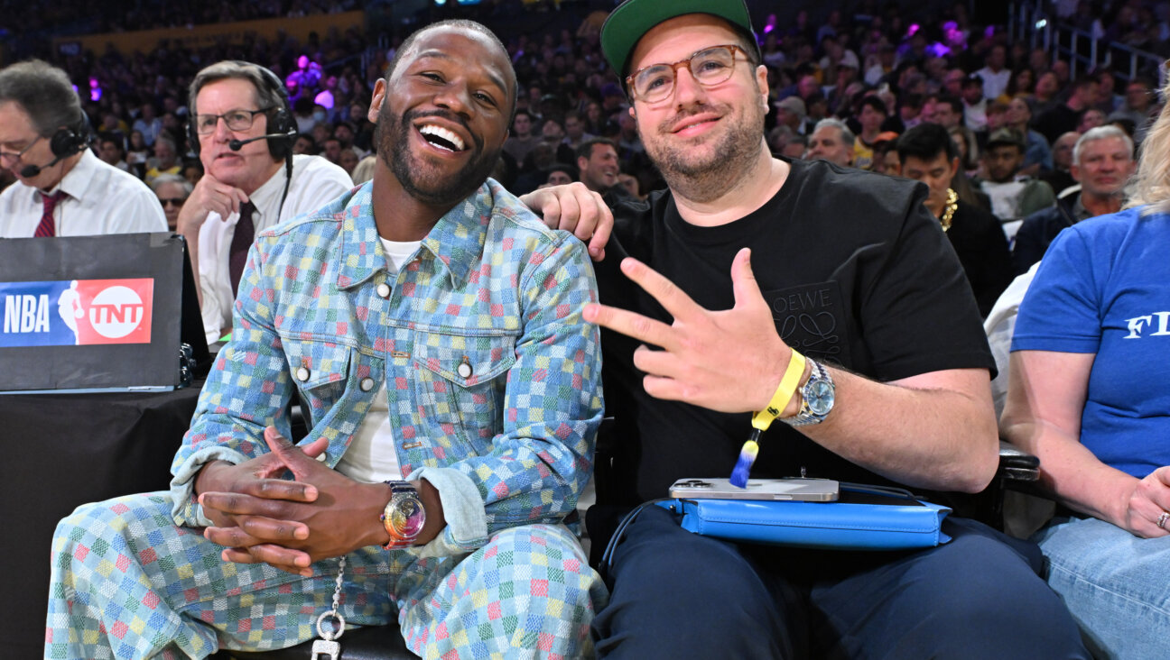Floyd Mayweather, Jr. (L), and his business partner Jona Rechnitz, seen together at a Lakers game in April 2025, are now at odds in a $175 million lawsuit.