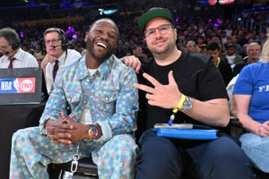 Floyd Mayweather, Jr. (L), and his business partner Jona Rechnitz, seen together at a Lakers game in April 2025, are now at odds in a $175 million lawsuit.