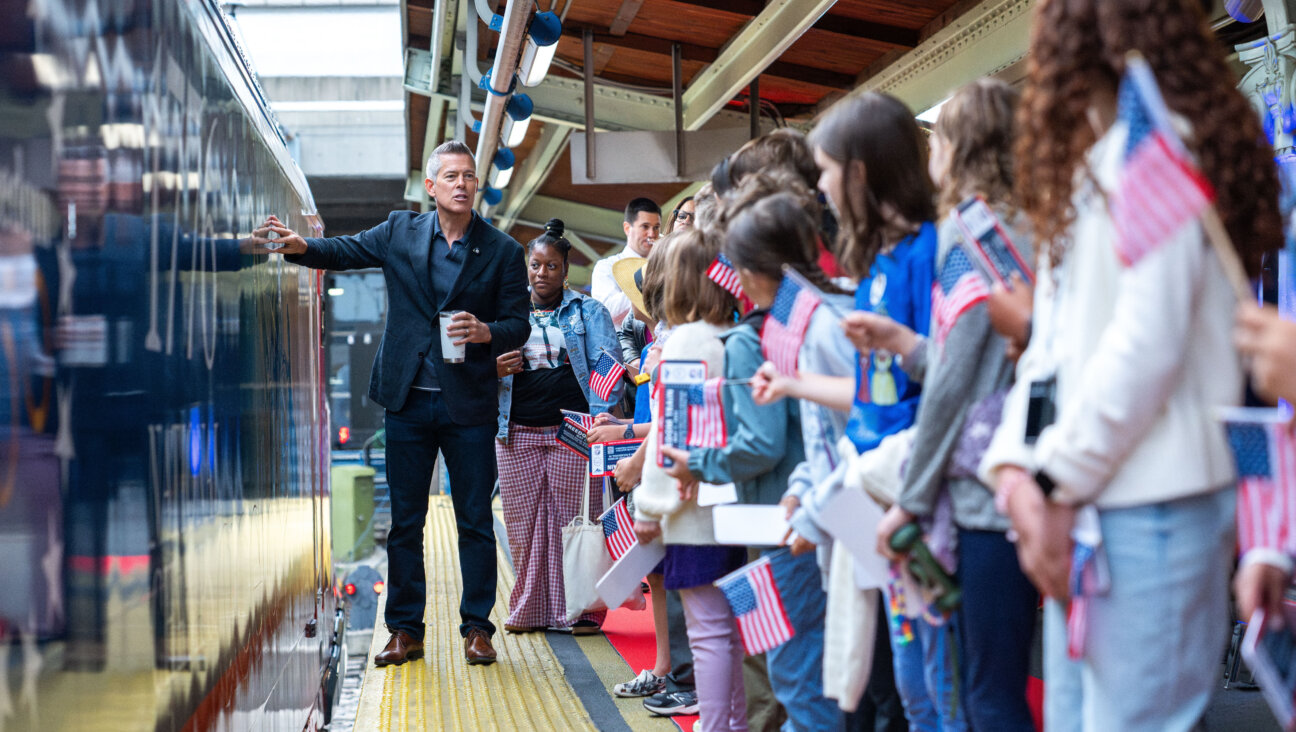 Students gather to welcome one of the events in the nation's celebration of it's 250th birthday, a "freedom 250" train.