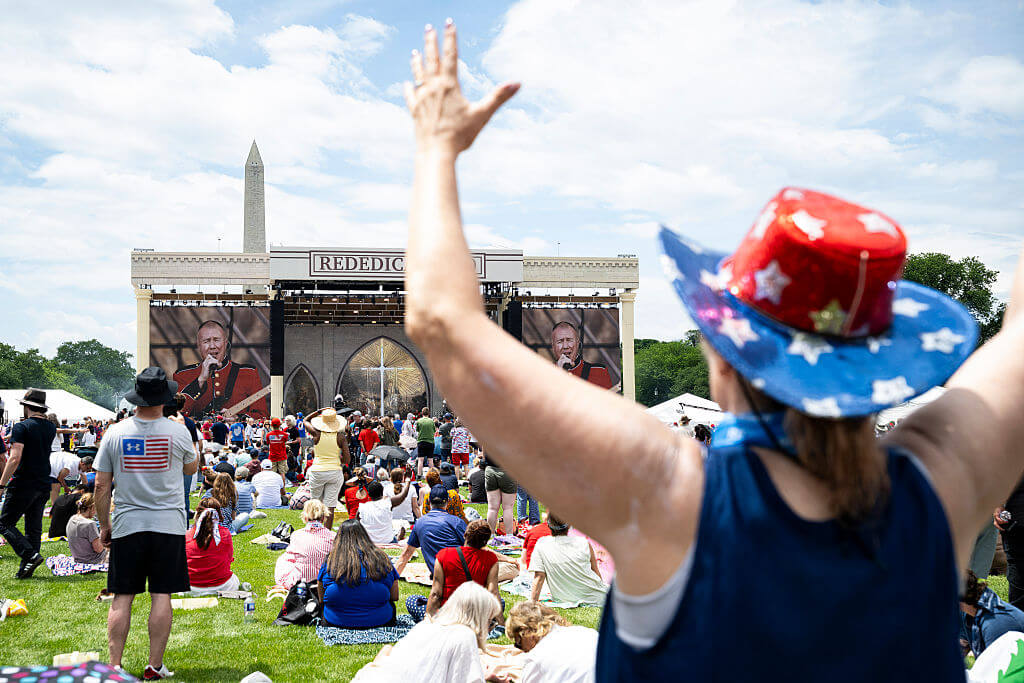 Attendees listen to a military band on stage during 'Rededicate 250: A National Jubilee of Prayer, Praise and Thanksgiving,' on the National Mall, on May 17.
