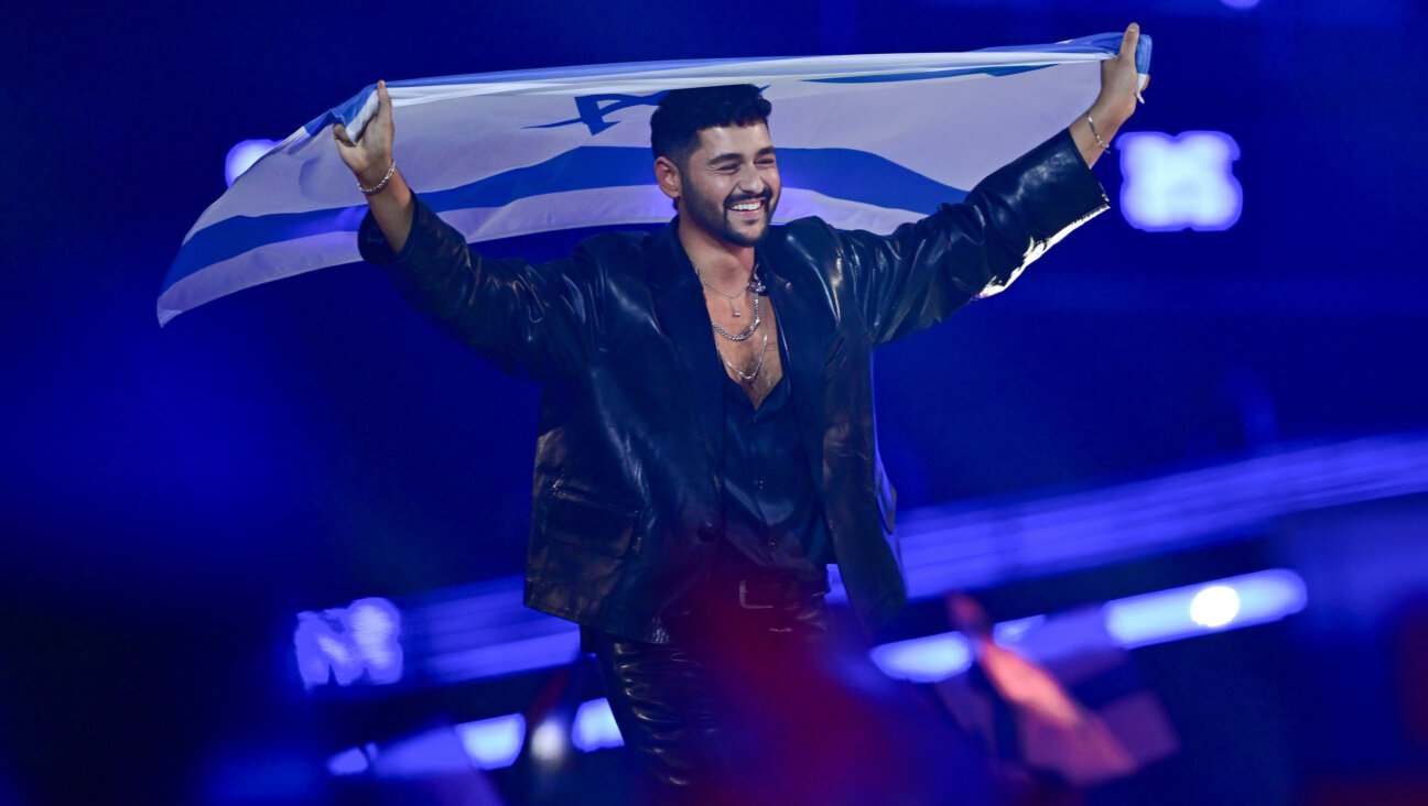 Noam Bettan representing Israel walks into the grand final carrying the Israeli flag during the Grand Final of the 70th Eurovision Song Contest at Wiener Stadthalle on May 16, 2026. 