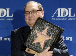 Abraham Foxman holds a replica of the Hollywood Walk of Fame Star as he is honored by the Anti-Defamation League 2014 Annual Meeting at The Beverly Hilton in Beverly Hills, California.