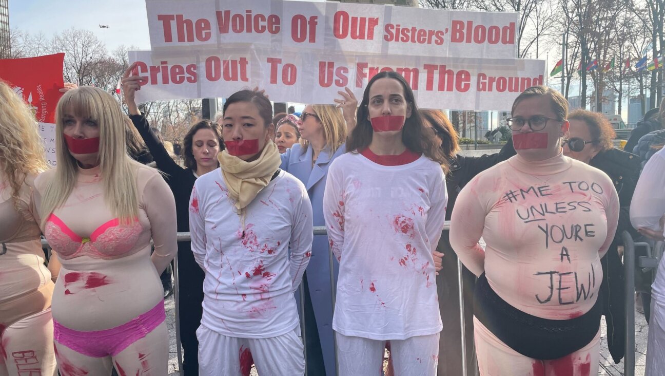 Protesters outside the United Nations on Dec. 4, 2023, call for condemnation of sexual violence perpetrated against Israeli women. (Luke Tress)