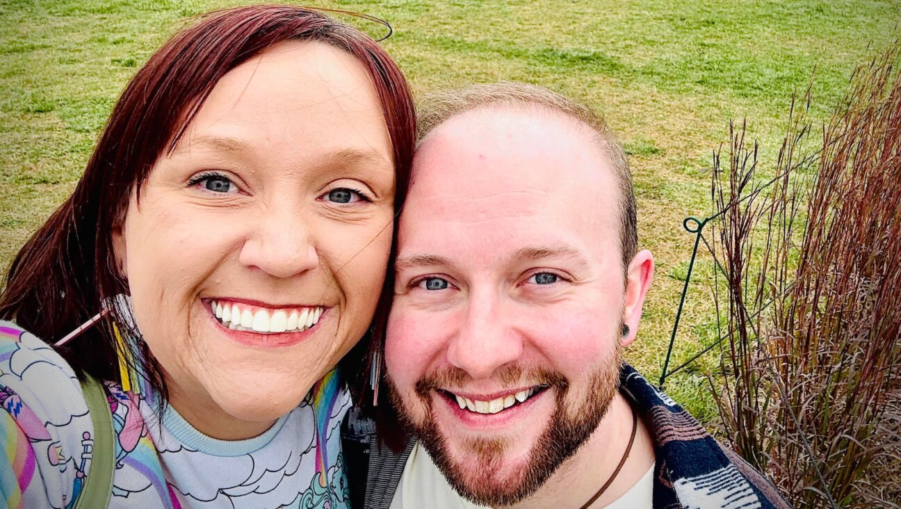 James Glick (R) and his wife, Gypsy Vickers (L) pose in a Minneapolis park after moving from Texas through a “Move to Thrive” loan. (Courtesy of James Glick)
