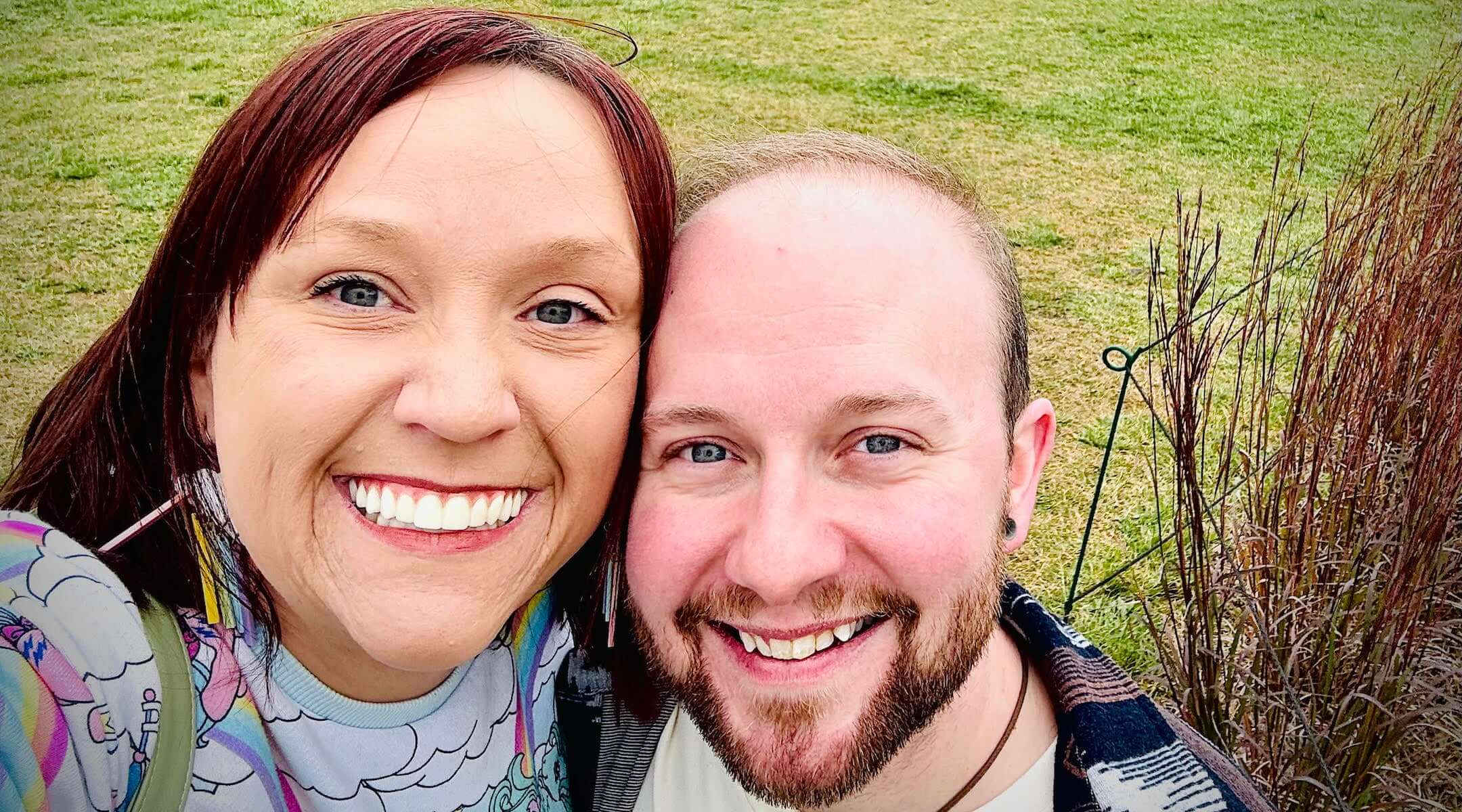 James Glick (R) and his wife, Gypsy Vickers (L) pose in a Minneapolis park after moving from Texas through a "Move to Thrive" loan.