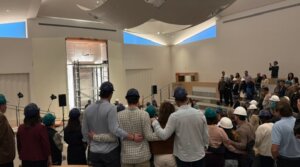 Kehillat Israel congregants gather in the remodeled sanctuary, while it is still under construction, ahead of the May 15 ceremony.