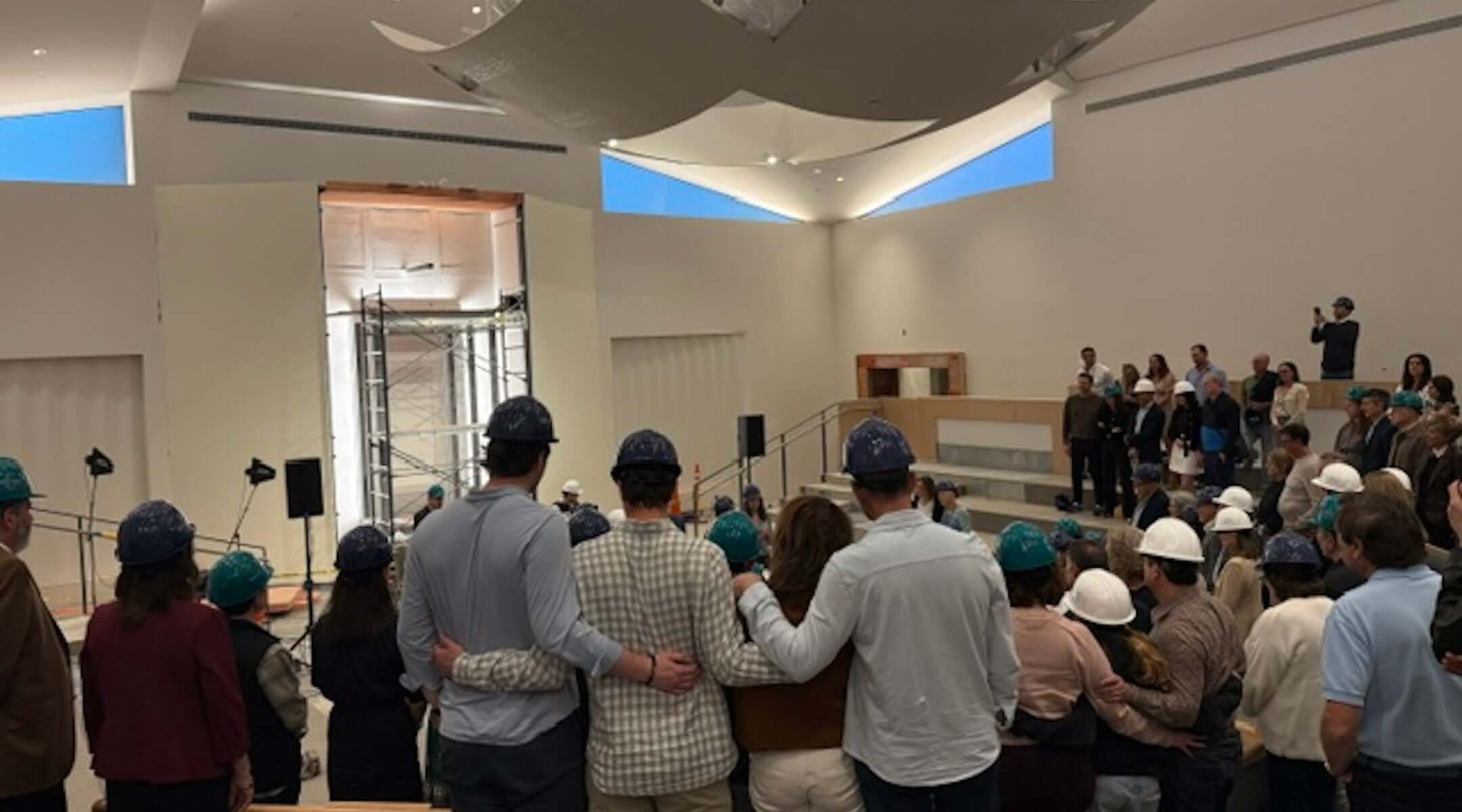 Kehillat Israel congregants gather in the remodeled sanctuary, while it is still under construction, ahead of the May 15 ceremony.